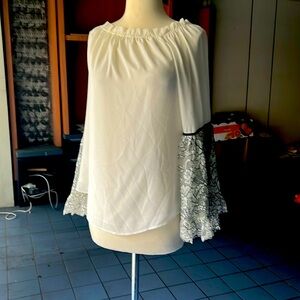 White flowy top with gorgeous decorative sleeves from White House Black Market.